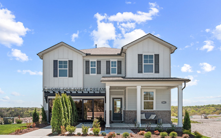 A white house with a blue sky.