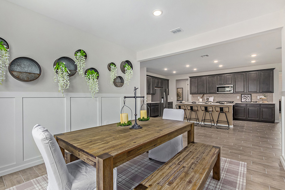 A kitchen with a dining table.