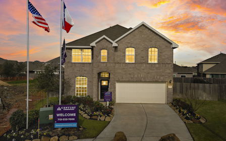 A house with flags in the front.