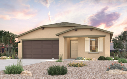 A house with a garage and bushes.