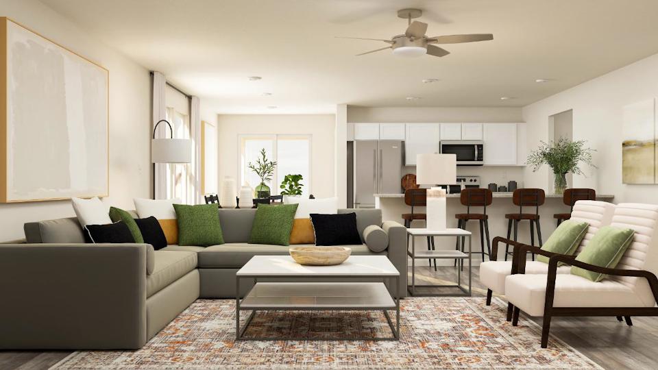 A living room with a couch and a table.