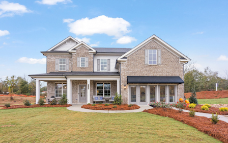 A large house with a lawn.