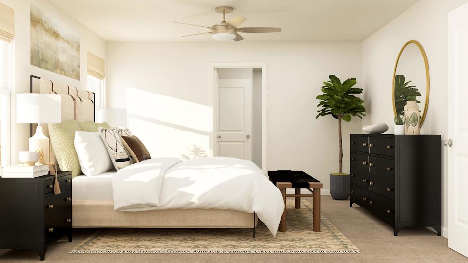 Owner's suite with attached bathroom and walk-in closet. 