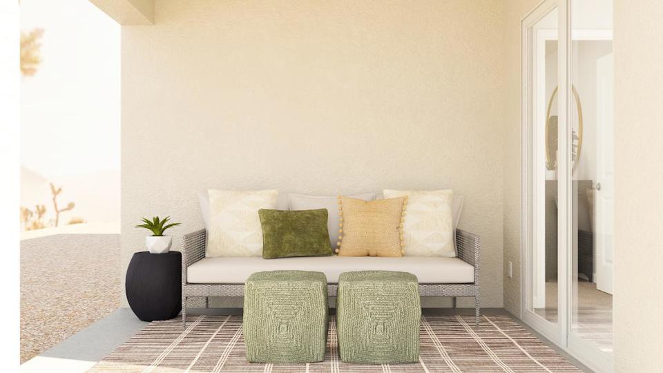 A couch and chairs in a room.