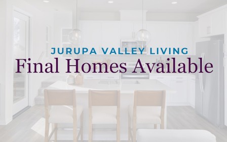 A dining room with a table and chairs.