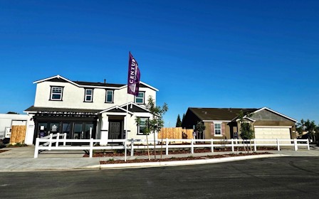 A house with a flag on the roof.