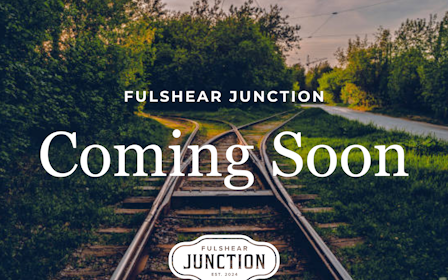 A train track with trees on the side.