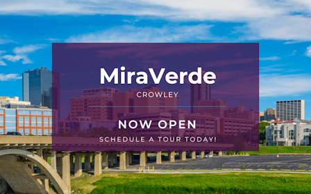 A large building with a bridge over a river.